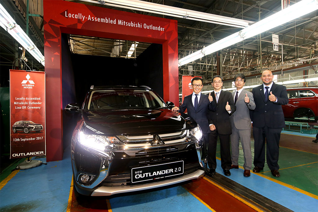 From-Left-to-Right--Mr.-Shinnishi,-CEO-of-MMM,-Mr.-Tan-Keng-Meng,-CEO-of-Warisan-Tan-Chong-Holdings,-Mr.-Otani,-Chief-Product-Specialist-of-Mitsubishi-Motors-Corporation-and-En.-Ilham-Helmi,-COO-of-MMM